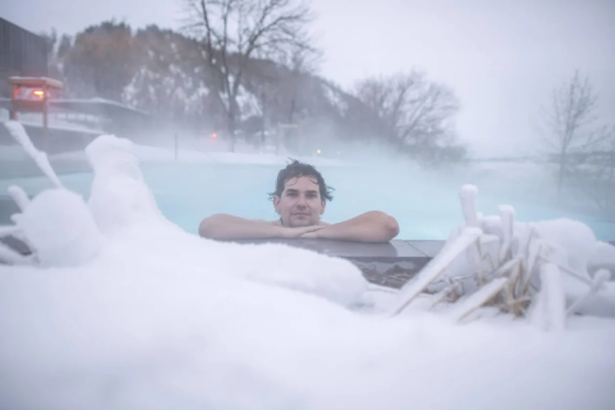 Man in thermal water at Strøm Nordic Spa
